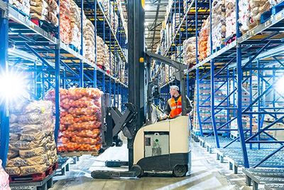 associate on a forklift in a warehouse